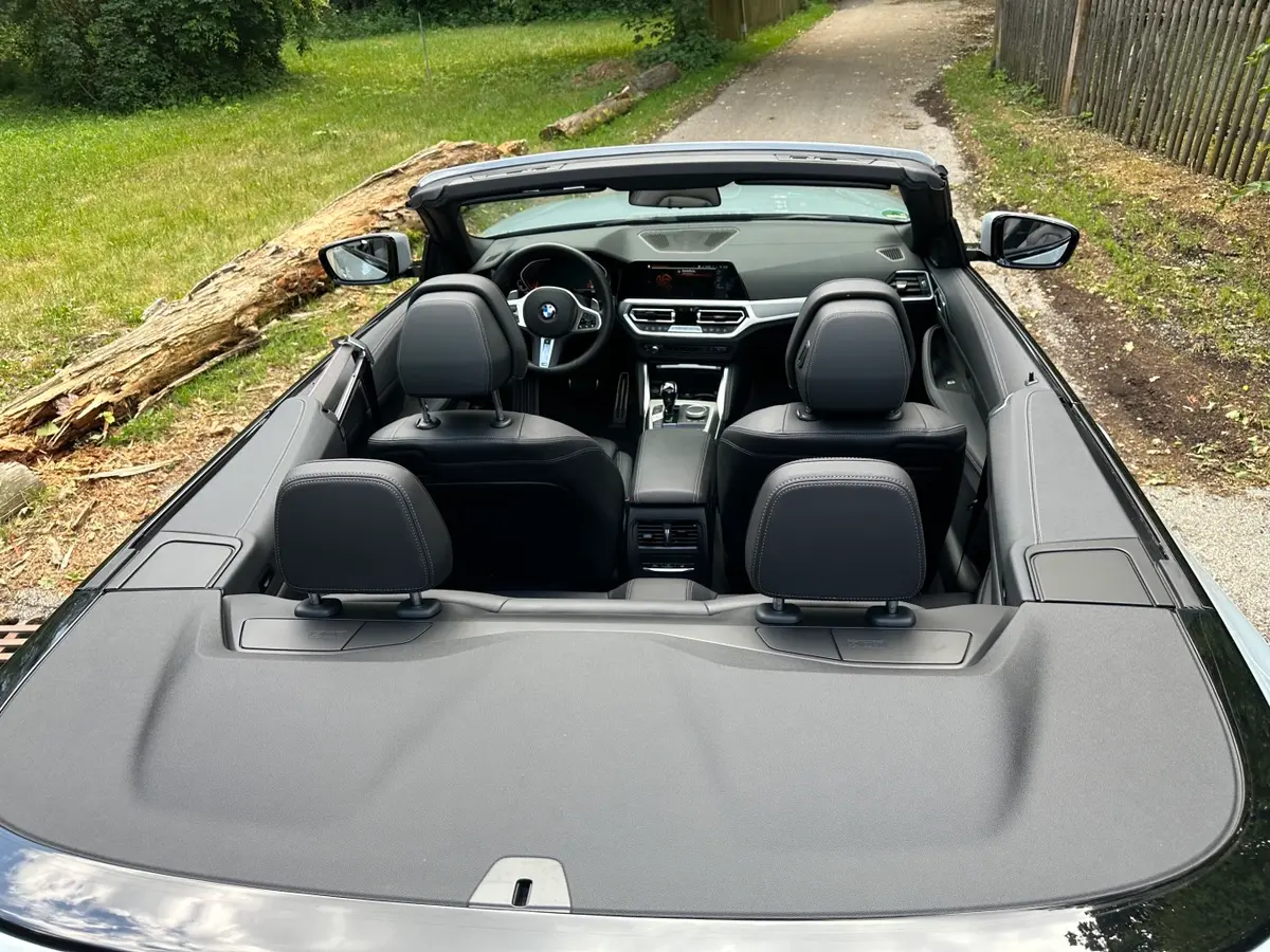 BMW 430i Cabrio 2023, rear view — Veyra Cars, Europe. The 2023 BMW 430i Cabrio pairs 245 hp with a folding roof, giving four seats and a…
