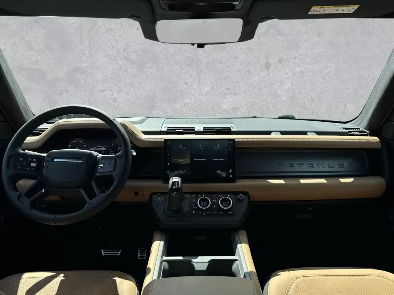 Land Rover Defender 2024, rear view — Veyra Cars, Europe. The 2024 Land Rover Defender pairs a 400 hp drivetrain with genuine seven-seat capacity,…